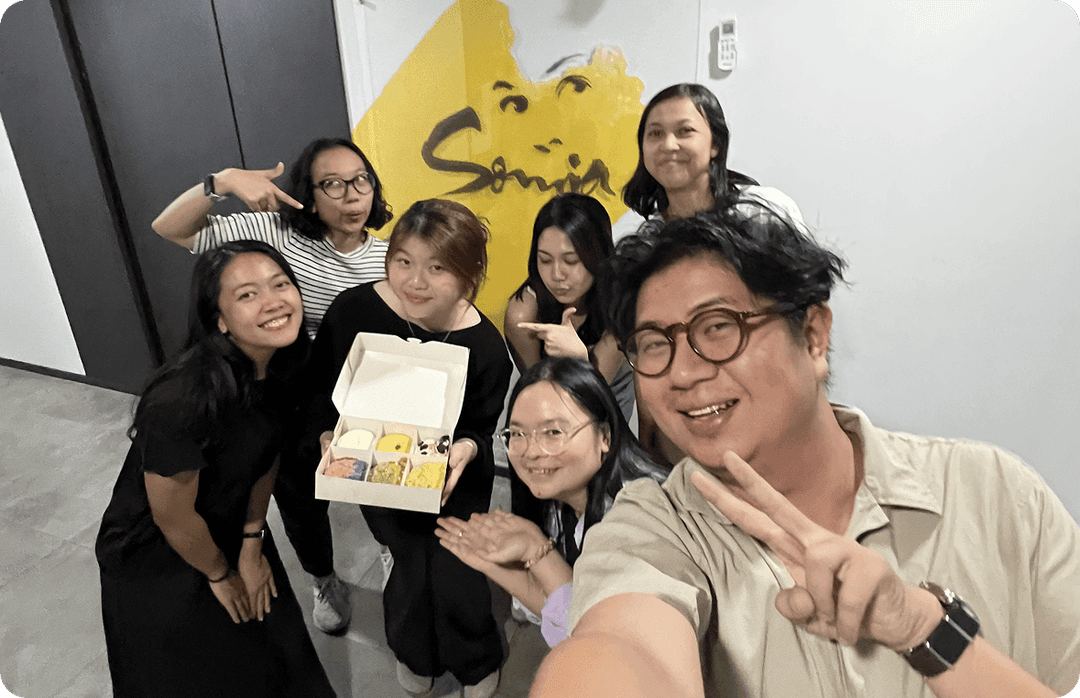SomiaCX team selfie celebrating together